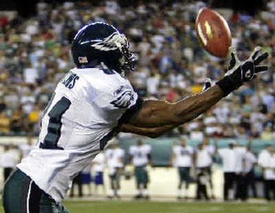 
Philadelphia Eagles receiver Terrell Owens scored on his first play Friday night. 
 (Associated Press / The Spokesman-Review)