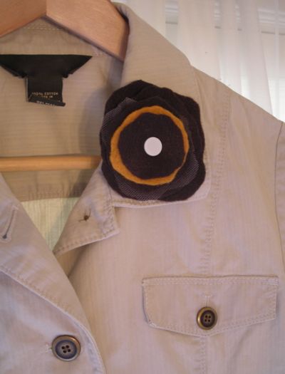 A felt flower punches up the lapel of a spring jacket. (Maggie Bullock)