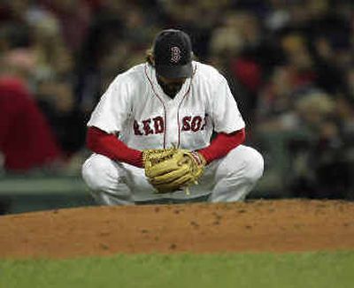 
Boston's Curtis Leskanic crouched on the mound after New York's Hideki Matsui doubled in the fourth. 
 (Associated Press / The Spokesman-Review)