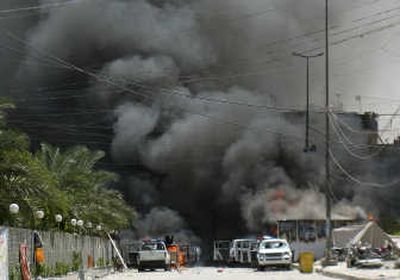 
Witnesses to the fighting Tuesday reported seeing dozens of bodies in the smoldering rubble of three Karbala buildings. Associated Press
 (Associated Press / The Spokesman-Review)