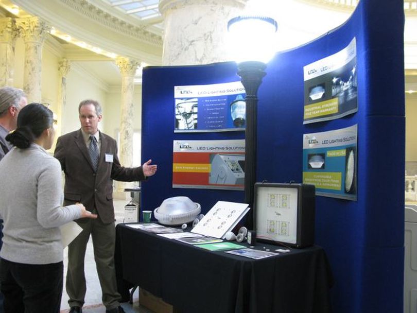 Locally made solar panels and high-output LED lights are among the items on display in the fourth-floor rotunda of the Capitol Thursday as part of 