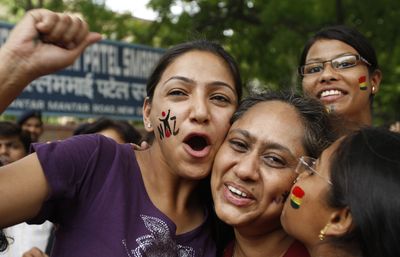 Gay-rights activists celebrate after the Delhi High Court passed a groundbreaking ruling Thursday decriminalizing homosexuality in New Delhi, India.  (Associated Press / The Spokesman-Review)