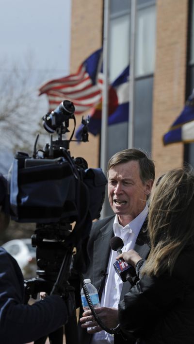 Colorado Gov. John Hickenlooper stops at the office of slain Department of Corrections Executive Director Tom Clements to support the staff on Wednesday. (Associated Press)