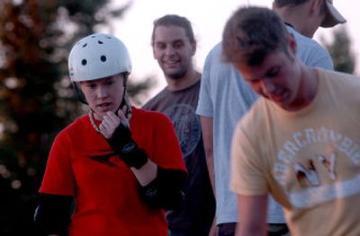 
Caitlin Sorenson, left, watches as Will Orr,  right, tries out a new longboard on a course in Lincoln Park July 31.  
 (KATE CLARK / The Spokesman-Review)
