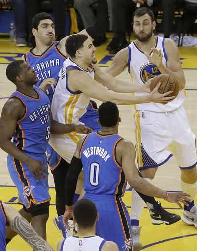 Golden State guard Klay Thompson, center, carried the Warriors offense in the absense of Stephen Curry. (Jeff Chiu / Associated Press)