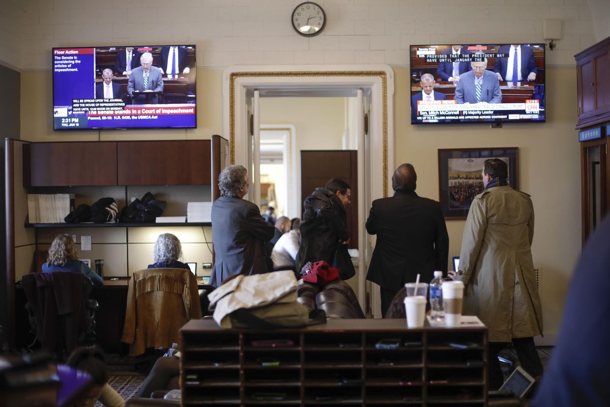 Members of the media in the press gallery watch a television monitors of Senate Majority Leader Mitch McConnell of Ky., speaking to members of the Senate for the impeachment trial against President Donald Trump at the U.S. Capitol in Washington, Thursday, Jan. 16, 2020. (Pablo Martinez Monsivais / Associated Press)