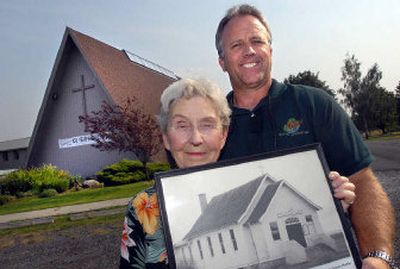 
Otis Orchards Community Church historian Pat Pfeiffer and Pastor Don Ensor display a photograph of how the church looked in the mid 1950s.  
 (Dan Pelle / The Spokesman-Review)