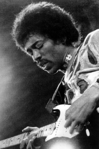 In this 1970  photo, musician Jimi Hendrix performs on the Isle of Wight in England. Hendrix will now have a post office near Renton, Wash., named after him. (Associated Press)