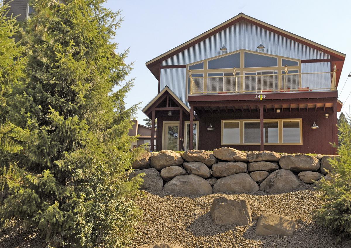 Metal siding and industrial lights frame the new home of Randy and Kelly Moffatt west of downtown Spokane. The home was designed in collaboration with architect Tom Thosath. (Christopher Anderson / The Spokesman-Review)