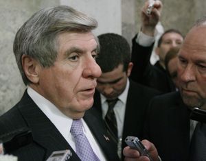 Sen. Ben Nelson, D-Neb., talks with reporters before heading into a Democratic caucus Wednesday.  (Associated Press)