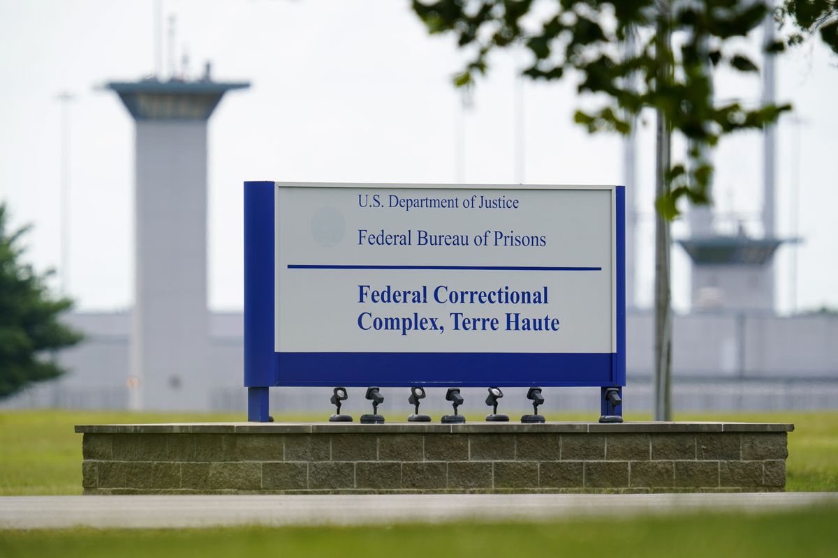 FILE - This Aug. 28, 2020, file photo shows the federal prison complex in Terre Haute, Ind. The Justice Department has scheduled three more federal executions during the lame-duck period before President-elect Joe Biden takes office, including two just days before his inauguration. In a court filing Friday night, Nov. 20, 2020 the Justice Department said it was scheduling the executions of Alfred Bourgeois for Dec. 11 and Cory Johnson and Dustin Higgs for Jan. 14 and 15.  (Michael Conroy)