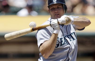 Seattle’s Mike Sweeney gets a close-up look at a ball he fouled off in the second inning of Monday’s loss.  (Associated Press / The Spokesman-Review)