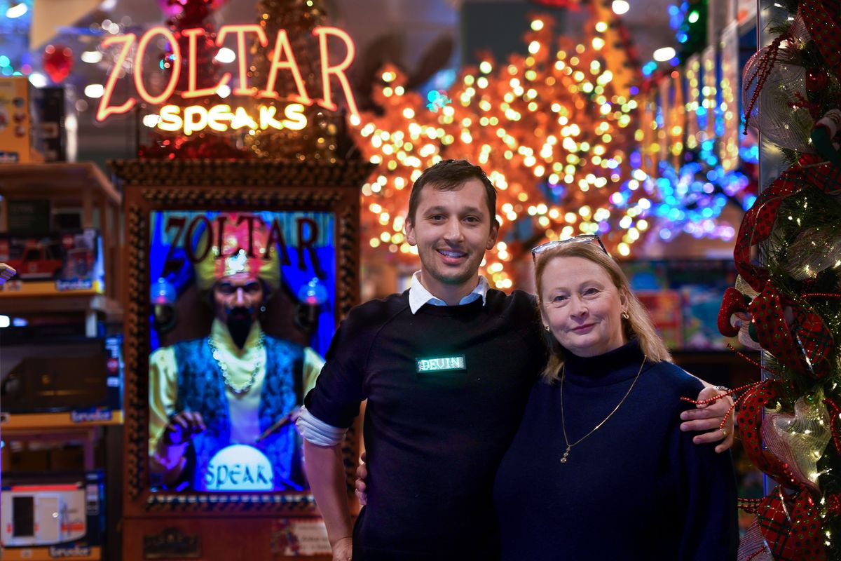 Devin Sommer and his mother, Susan Sommer, owner of Figpickels Toy Emporium, are surrounded by the Coeur d’Alene toy store’s offerings.  (Kathy Plonka/The Spokesman-Review)