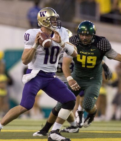 Oregon defenders like Nick Reed wreaked havoc on Washington quarterback Jake Locker. (Associated Press / The Spokesman-Review)
