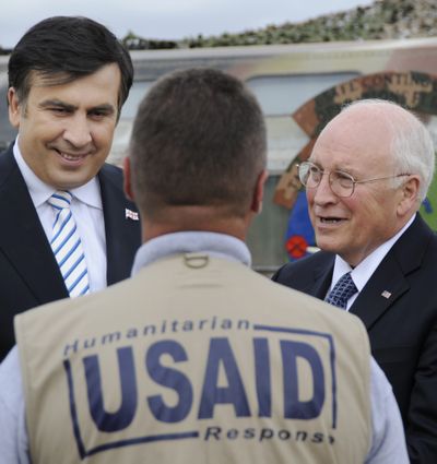 Georgian President Mikhail Saakashvili, left, and U.S. Vice President Dick Cheney inspect humanitarian aid at an airport in Tbilisi, Georgia, on Thursday.  (Associated Press / The Spokesman-Review)