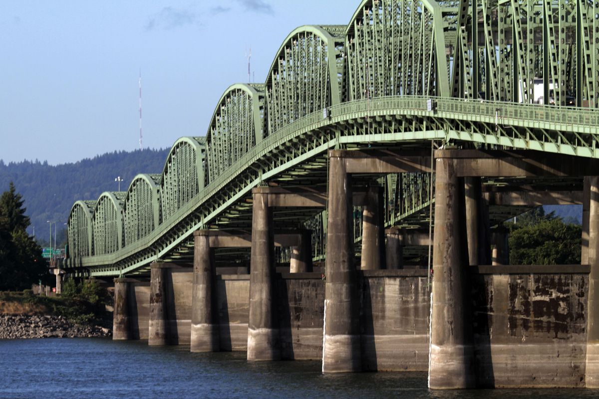 The Interstate 5 bridge crosses the Columbia River between Oregon and Washington states in Vancouver, Wash. One of the casualties of the coming federal budget crunch could be a new $3 billion bridge to replace the current bridge. (Associated Press)