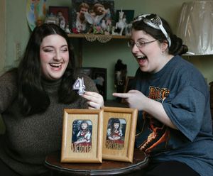 In this Feb. 20, 2012, photo, twins Victoria, left, and Bethany Lawler, born Feb. 29, 1996, pose next to photos of themselves on their first birthday in 2000, in West Richland, Wash. The girls celebrated their fourth birthday in 2012. They will celebrate their fifth birthday on Feb. 29, 2016. (AP Photo/The Tri-City Herald, Kai-Huei Yau)  