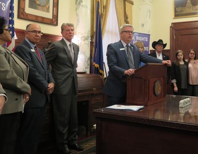 Sen. Todd Lakey, R-Nampa, speaks out in favor of a crime victim rights constitutional amendment on Thursday, joined by state officials, prosecutors, law enforcement representatives and crime victims. At left are Sen. Cherie Buckner-Webb, Sen. Chuck Winder, and Gov. Butch Otter; at right in the black hat is Canyon County Sheriff Kieran Donahue. (Betsy Z. Russell)