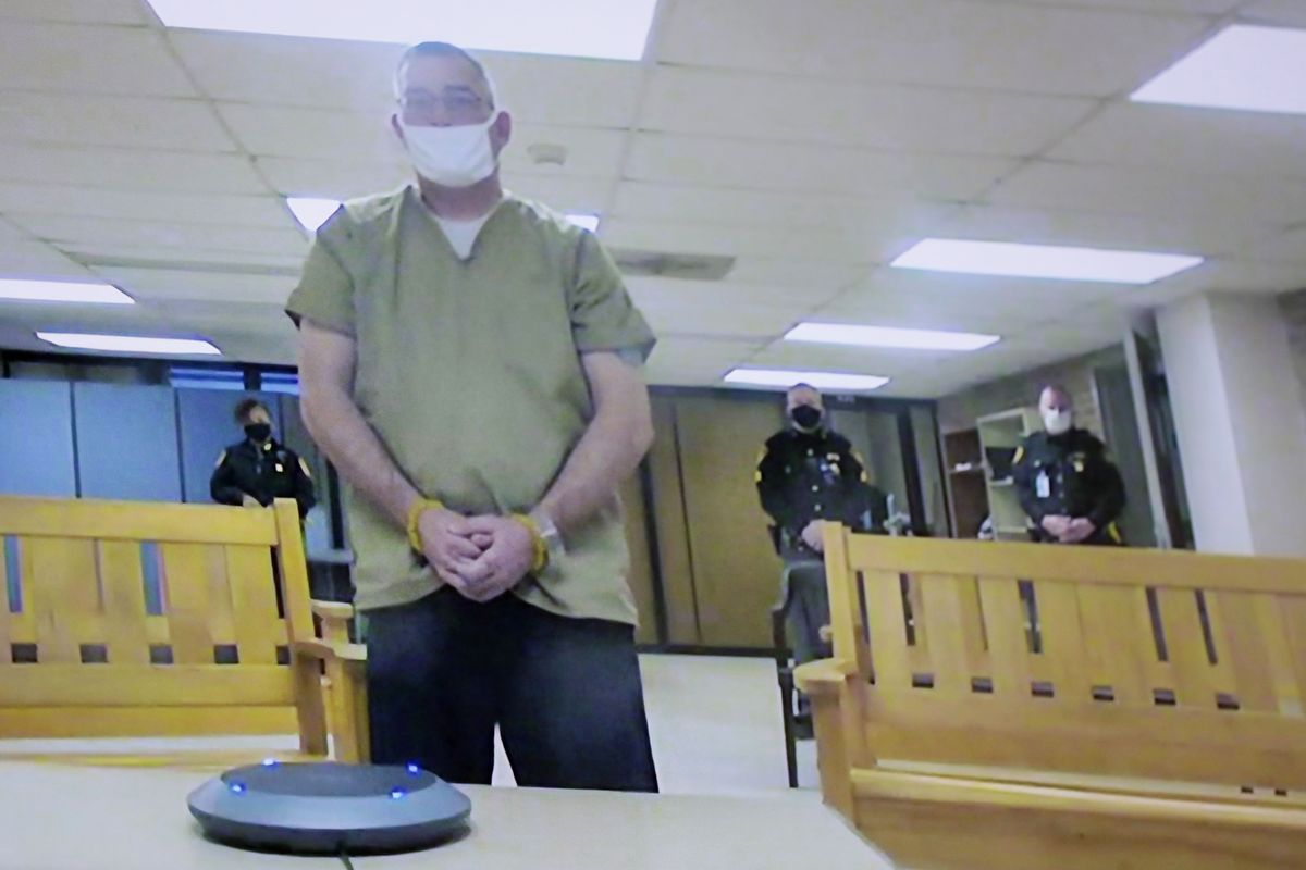 Former Columbus police officer Adam Coy is seen remotely on television during his initial appearance on Friday, Feb. 5, 2021, at the Franklin County Common Pleas Courthouse in Columbus, Ohio. Coy was arraigned on four charges in the December 2020 police shooting death of Andre Hill, a Black man. Coy was charged with one count of murder, one count of felonious assault, and two counts of dereliction of duty, one of which was for failure to render aid to Hill after he was shot. His bond was set at $3.3 million.  (Joshua A. Bickel)