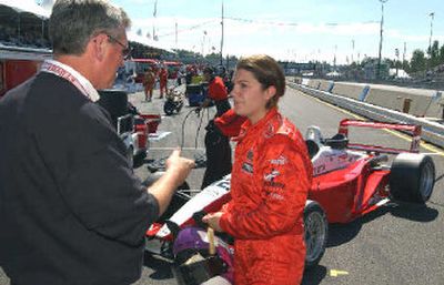 
Katherine Legge is congratulated on placing fourth in Toyota Atlantic race by team owner Jim Griffith at Portland. 
 (Associated Press / The Spokesman-Review)