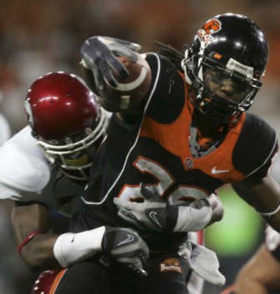 
Oregon State's Yvenson Bernard scores against Utah Thursday. The Beavers won 24-7.Associated Press
 (Associated Press / The Spokesman-Review)