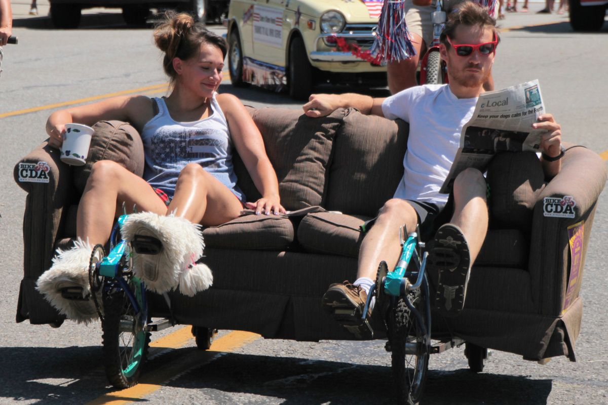 Kelsey Wheeler and Eric Satrin ride their couch-cycle in Coeur d’Alene’s Fourth of July parade. They plan to participate in Sunday’s parade as well.