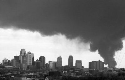 
 Smoke  spreads over downtown  Kansas City, Mo., on Wednesday as a fire burns at a chemical plant in an industrial area of the city.  Officials evacuated people within a one-mile radius of the plant. 
 (Associated Press / The Spokesman-Review)
