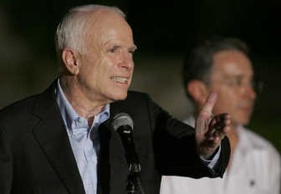 U.S. Sen. John McCain speaks Tuesday in Cartagena, Colombia, as Colombia's President Alvaro Uribe looks on. McCain was on a three-day tour of Latin America. Associated Press
 (Associated Press / The Spokesman-Review)