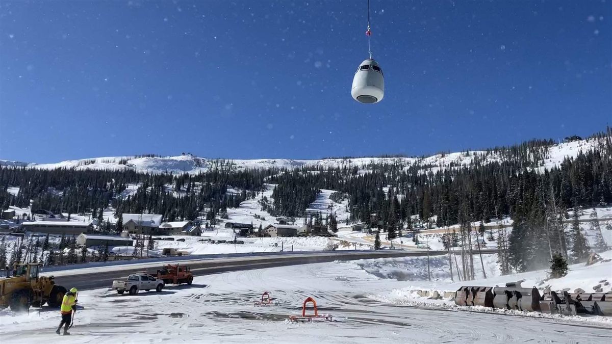 A helicopter picks up an egg-shaped remote avalanche exploder, which it transported to an area near U.S. Highway 160 Wolf Creek Pass in southwest Colorado in November 2022.  (Tribune News Service)