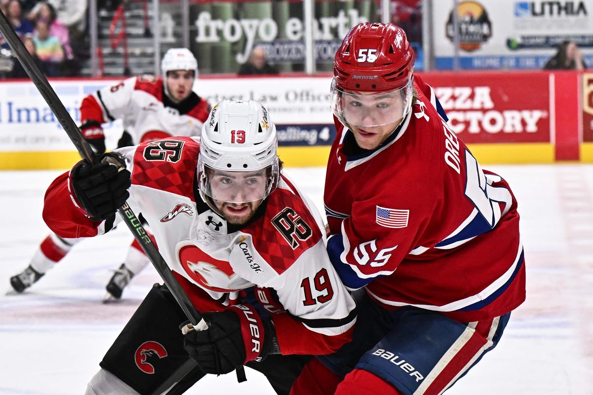 Spokane Chiefs left wing Sam Oremba (55) fights for position against Prince George Cougars center Riley Ashe (19) during the first period of a WHL 1st round Playoff game on Monday, March 30, 2026, at the Numerica Veterans Arena in Spokane, WA. (James Snook/For The Spokesman-Review)