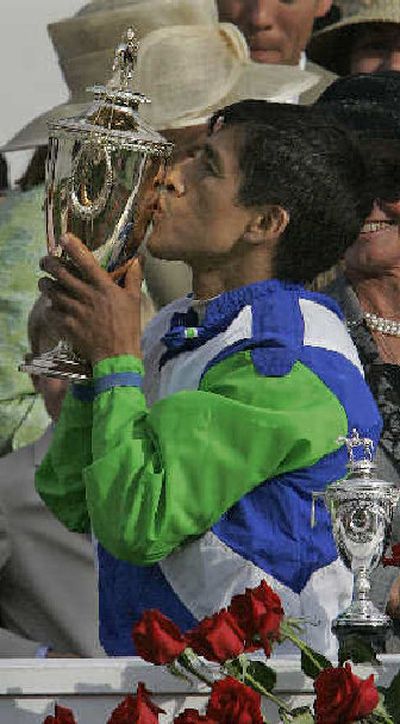 
Jockey Edgar Prado kisses the winner's trophy after Barbaro's victory in the 132nd Kentucky Derby.
 (Associated Press / The Spokesman-Review)