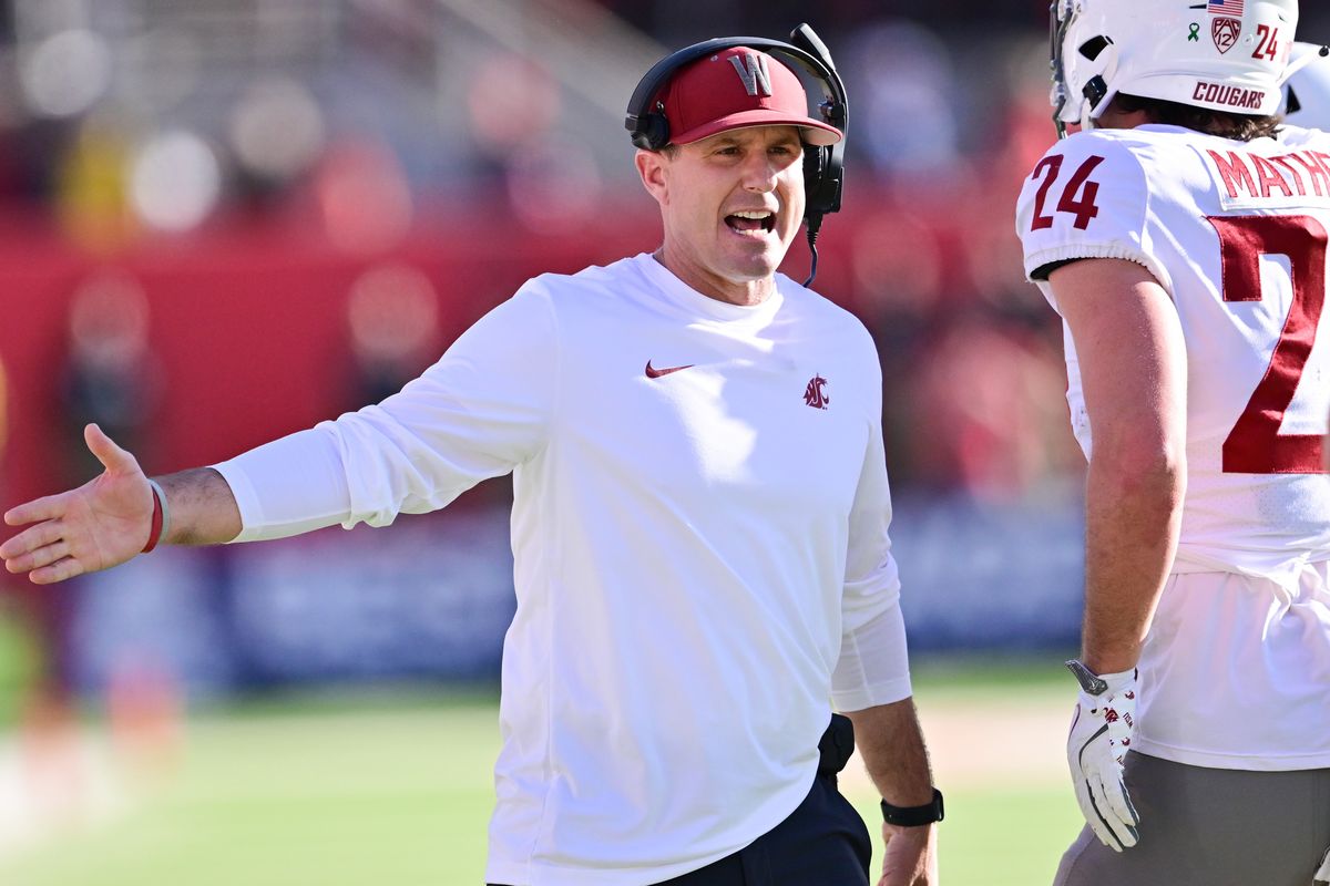 Washington State head coach Jake Dickert grabs a high-five after the Cougars scored during the first half of a Saturday’s game at Valley Children’s Stadium in Fresno, Calif.  (Tyler Tjomsland/The Spokesman-Review)