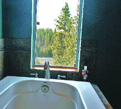 
The master bathroom features breathtaking views of west Spokane.
 (The Spokesman-Review)