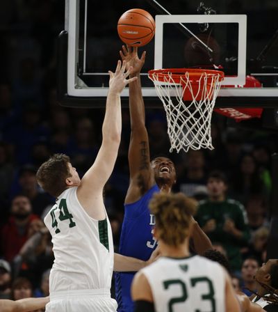 Portland State’s Ryan Edwards takes a shot while being defended by Duke’s Wendell Carter Jr. on Thursday at the PK80. (Timothy J. Gonzelez / Associated Press)