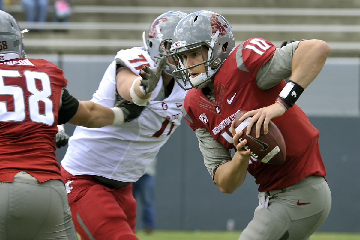 Jeff Tuel can’t get away from Matthew Bock during the Crimson and Gray Game. (Dan Pelle)