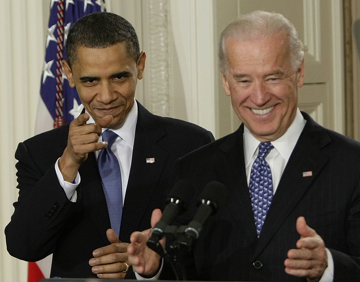 President Barack Obama and Vice President Joe Biden react to cheers as they arrive in the East Room of the White House in Washington,Tuesday, March 23, 2010, for the signing ceremony for the health care bill. (J. Applewhite / Associated Press)