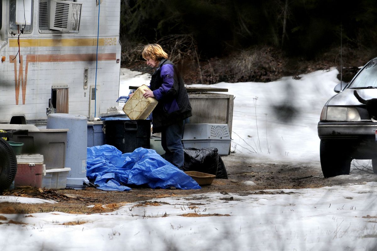 A woman believed to be Cheryl Criswell is seen at  the Criswell home in Bonners Ferry on Thursday. Local law enforcement has been notified because of the more than 40 cats living with Cheryl and Ed Criswell in three travel trailers. (Kathy Plonka)