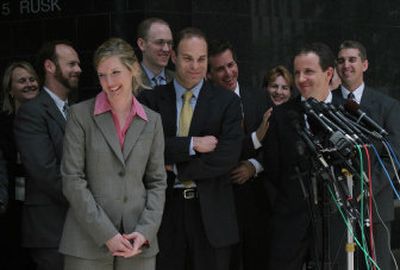
Federal prosecutors address the media outside the courthouse Thursday after guilty verdicts were delivered in the fraud and conspiracy trial of former Enron executives Ken Lay and Jeff Skilling. 
 (Associated Press / The Spokesman-Review)