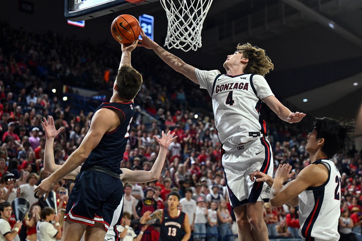 Gonzaga Dusty Stromer (4) prevents a shot by Lewis and Clark State guard John Lustig (1) during the second half of a NCAA college basketball game, Friday, Nov. 3, 2023, in the McCarthey Athletic Center.  (Colin Mulvany / The Spokesman-Review)