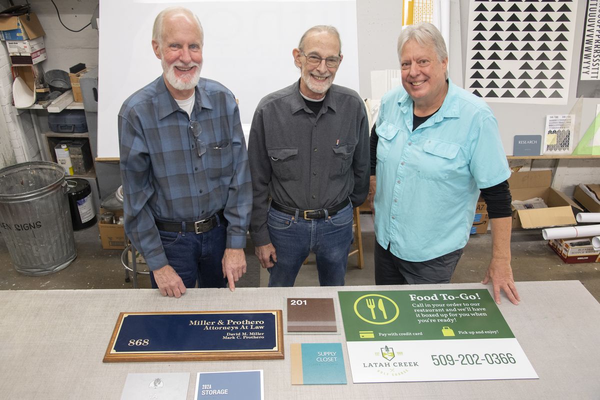 Brothers, from left to right, Nick, Chris and Steve Linden have run Vic. B Linden Signs in Spokane for many decades, following in their father’s footsteps, shown Monday, Oct. 25, 2021 at their shop 122 S. Lincoln St. The brothers plan to shut the business down because they can’t find a buyer for it. The brothers have been working in the business since the 1960s and are experts in the many processes of making signs, including woodworking, metalworking, screen printing, computer printing and many other processes.  (Jesse Tinsley/THE SPOKESMAN-REVIEW)