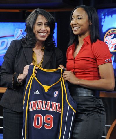 Briann January shows off her  Fever jersey with WNBA president Donna Orender, left.  (Associated Press / The Spokesman-Review)