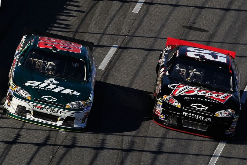 Kevin Harvick passes Dale Earnhardt Jr. for the lead on lap 497 during the Goody's Fast Relief 500 at Martinsville Speedway. (Photo Credit: Chris Trotman/Getty Images) (Chris Trotman / Getty Images North America)