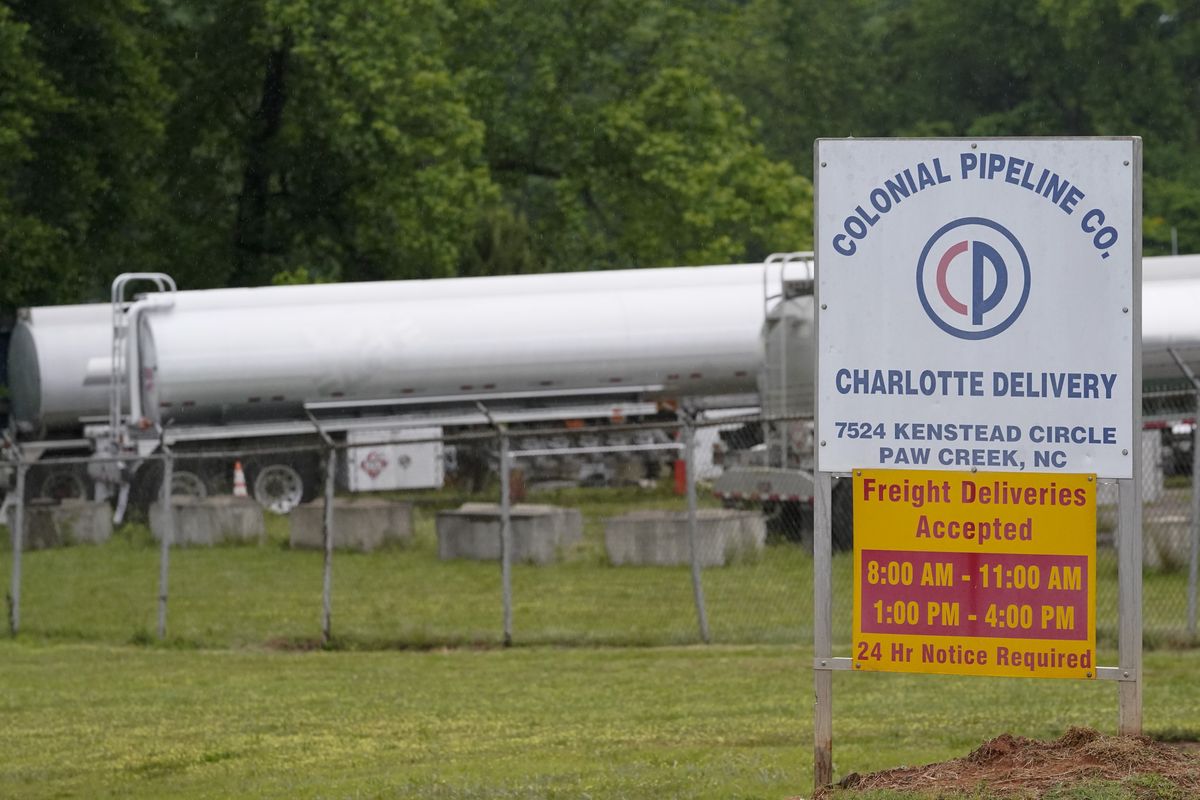 Tanker trucks are parked near the entrance of Colonial Pipeline Company Wednesday, May 12, 2021, in Charlotte, N.C. The operator of the nation’s largest fuel pipeline has confirmed it paid $4.4 million to a gang of hackers who broke into its computer systems. That
