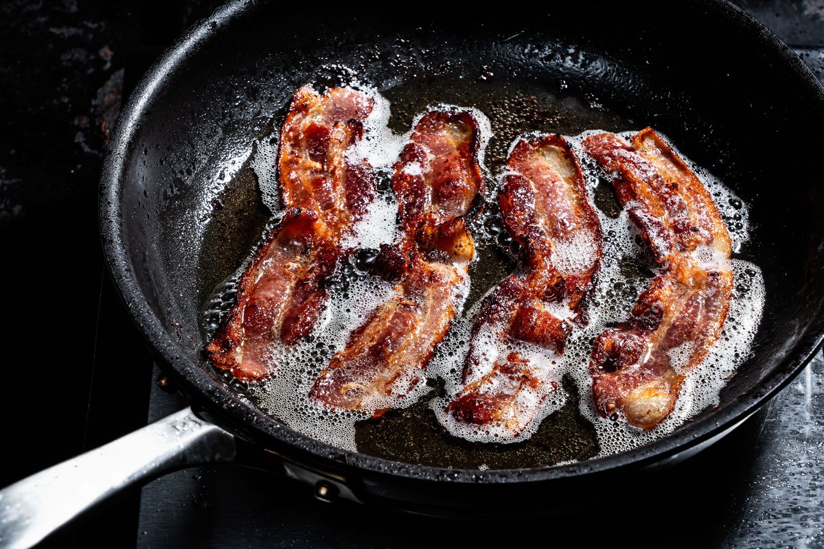 Bacon cooked in a skillet.  (Scott Suchman/For the Washington Post)