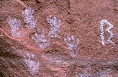 
Pictographs feature hand prints near Perfect Kiva Ruin in the Grand Gulch area of southeastern Utah. Hikers and archeologists are left to wonder the meaning of the artwork left on the canyon walls hundreds of years ago by the Anasazi Indians. 
 (The Spokesman-Review)