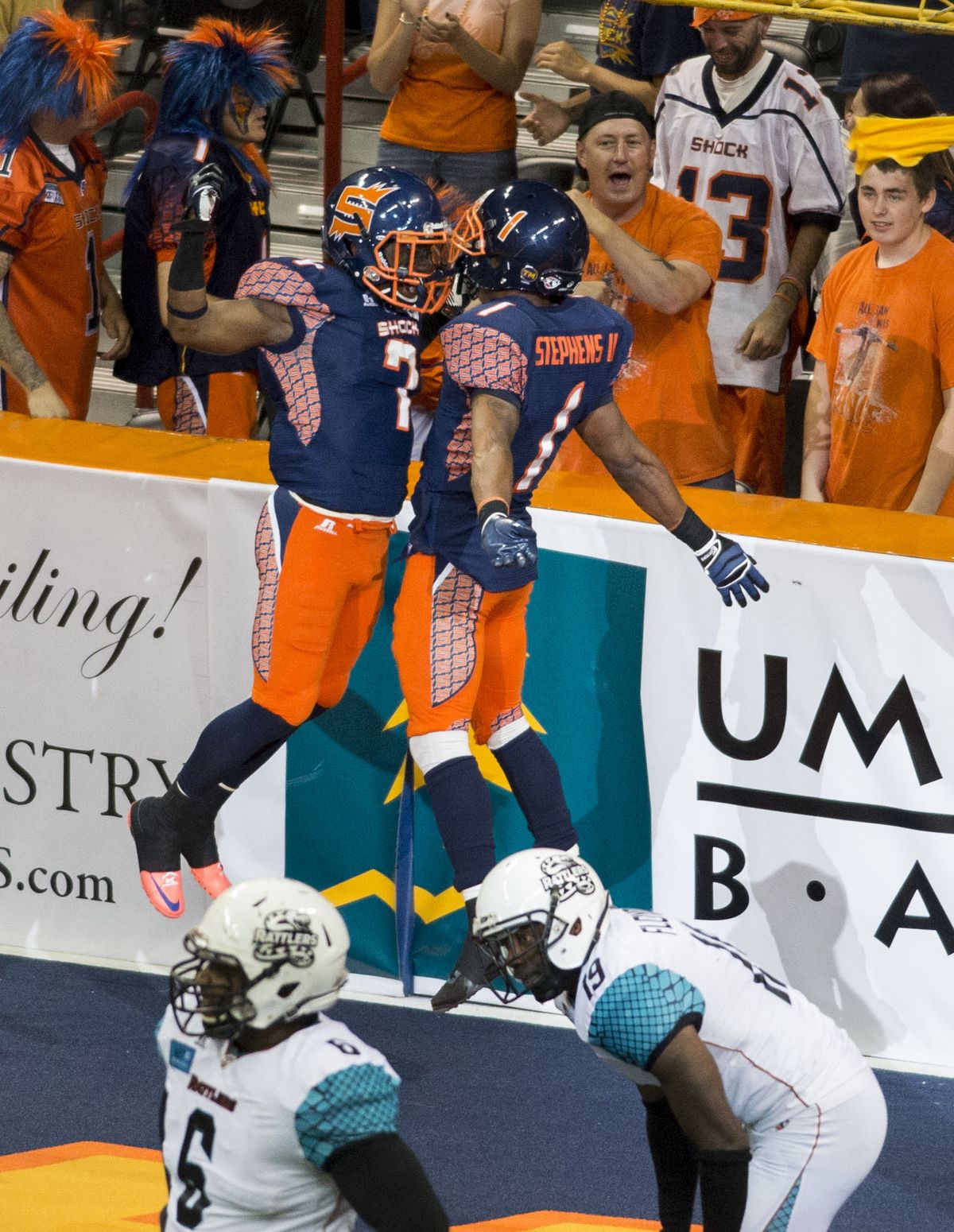 Shock’s Mike Washington (7) celebrates a fourth-quarter touchdown with teammate Paul Stephens. (Colin Mulvany)