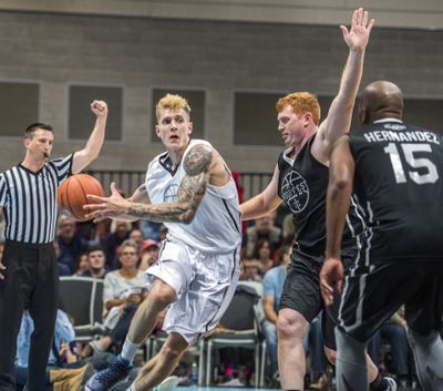 Former Zag Micah Downs drives against David Pendergraft during a Gonzaga alumni game in 2017.  (Dan Pelle / The Spokesman-Review)