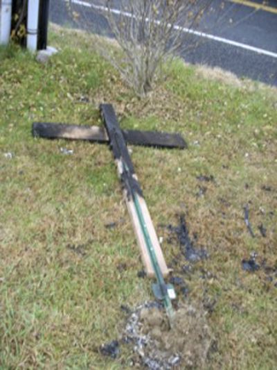 This undated file photo provided by Gary and Alina Grewal, of Hardwick Township, N.J., shows a charred cross that had been burned on the lawn of their home after they placed a banner congratulating President-elect Barack Obama.  (File Associated Press / The Spokesman-Review)