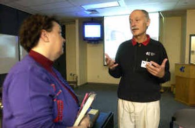 
Joe Morris, CEO of Kootenai Medical Center, chats with Debi Schoonover, a registered nurse, after an employee meeting about the outlook for the hospital Thursday at KMC. 
 (Jesse Tinsley / The Spokesman-Review)