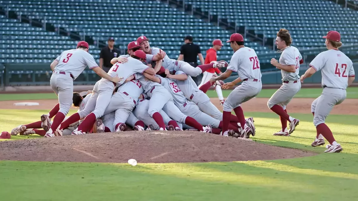Washington State players dogpile near the pitchers mound after winning the Mountain West Tournament championship on Sunday in Mesa, Ariz.  (Courtesy of WSU Athletics)